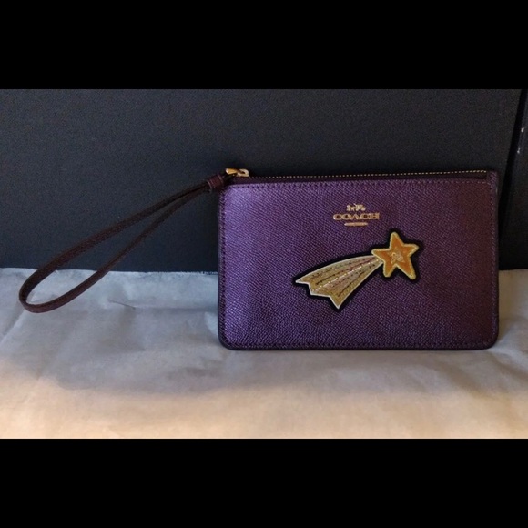 Coach Handbags - NWT Coach raspberry wristlet with gold star